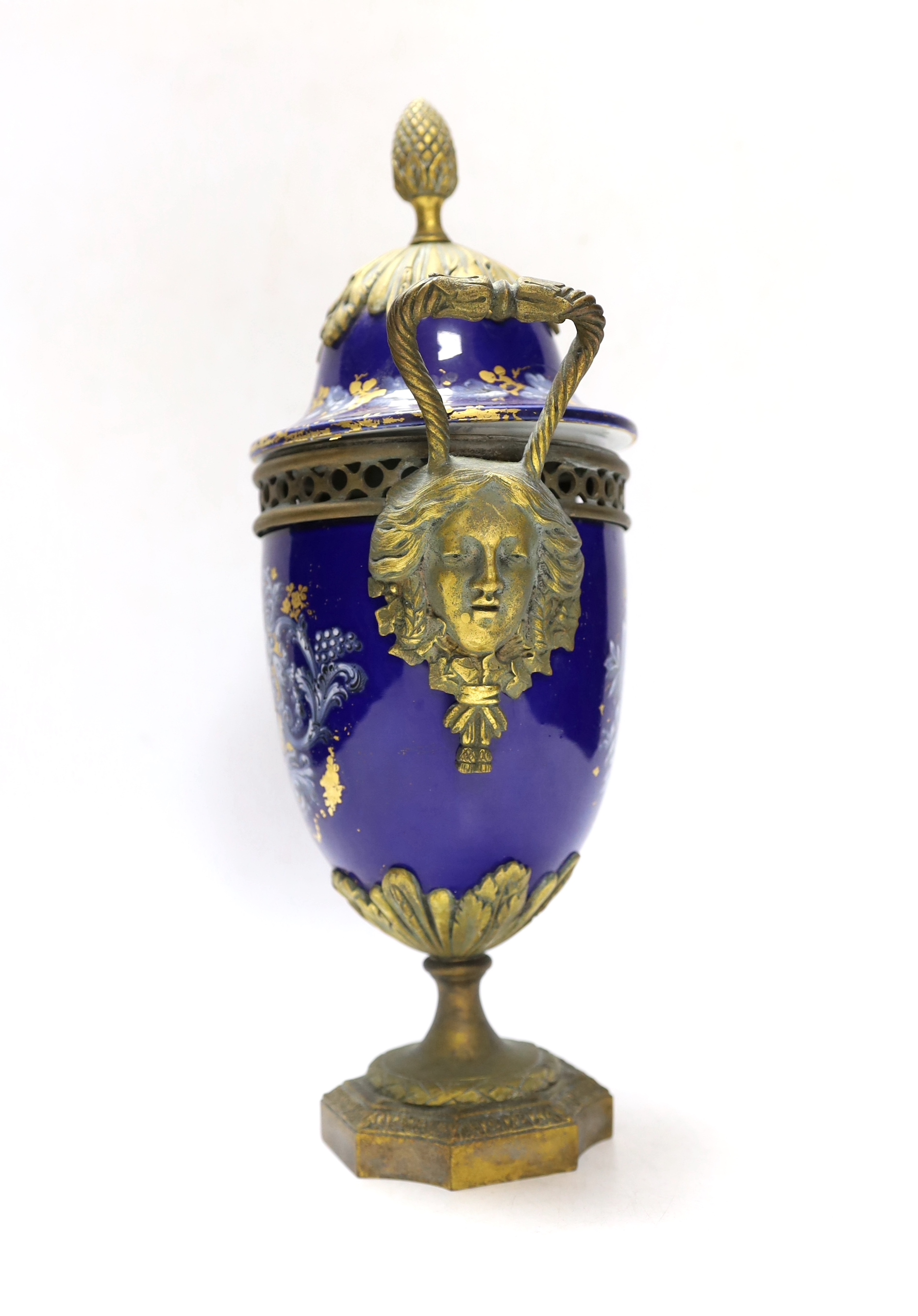 A Limoges style porcelain ormolu mounted urn and cover, 29cm high